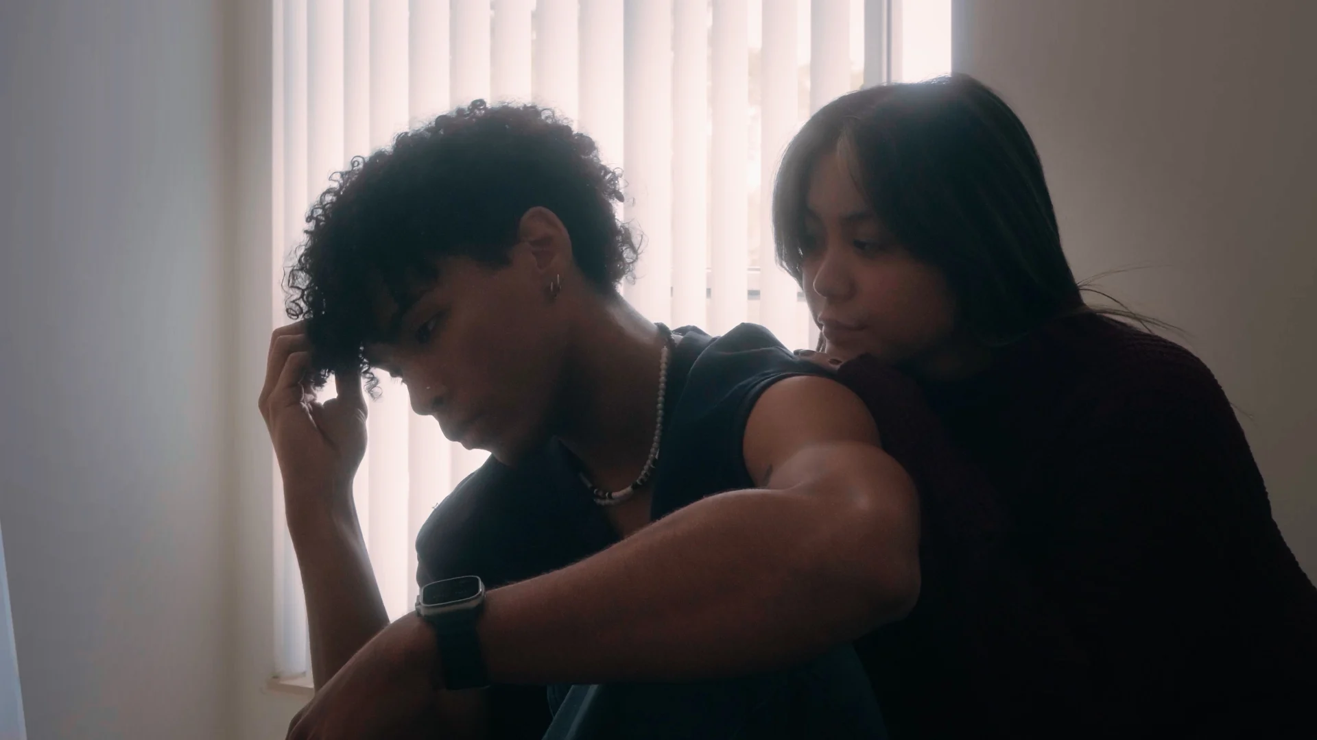 December — Lizette and Meekel lying apart in a dim bedroom
