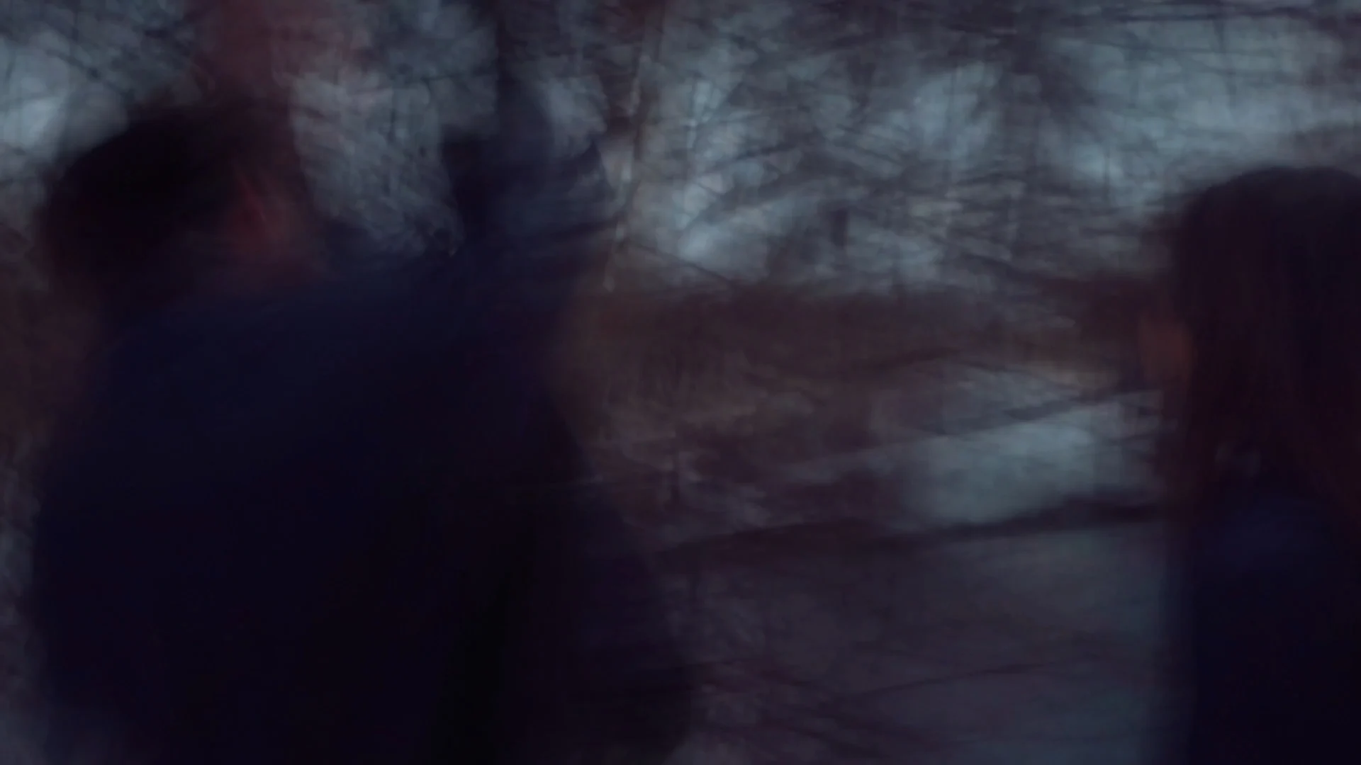 A couple rendered as a blurred double exposure