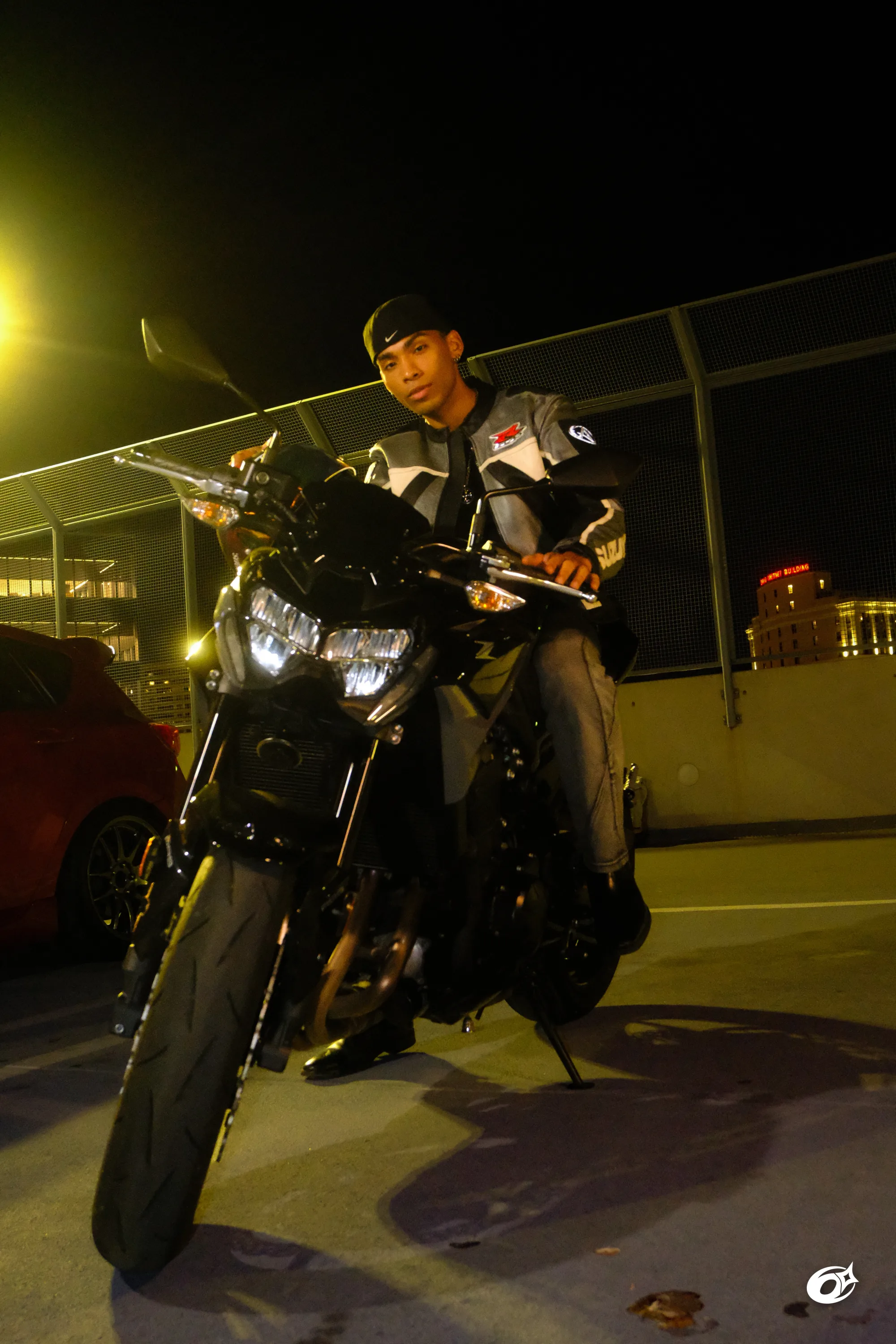 Meekel sitting on a motorcycle